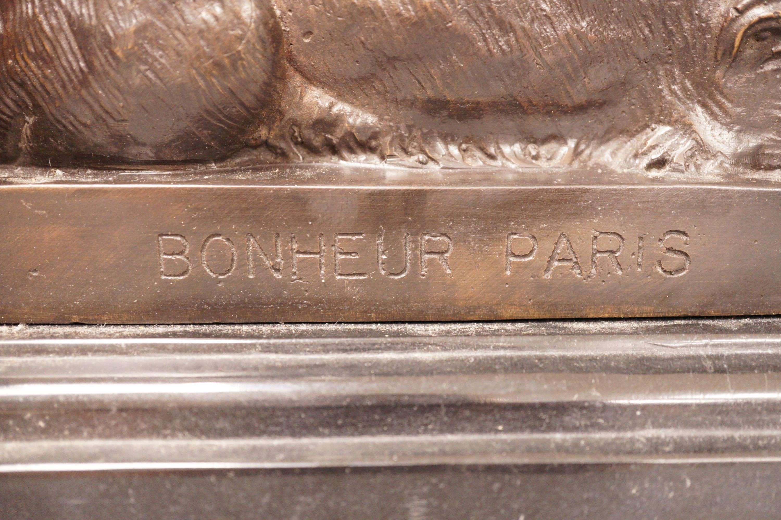 After Isadore Bonheur a bronze figure of a recumbent lion, on marble base, 20th century, 35cm
